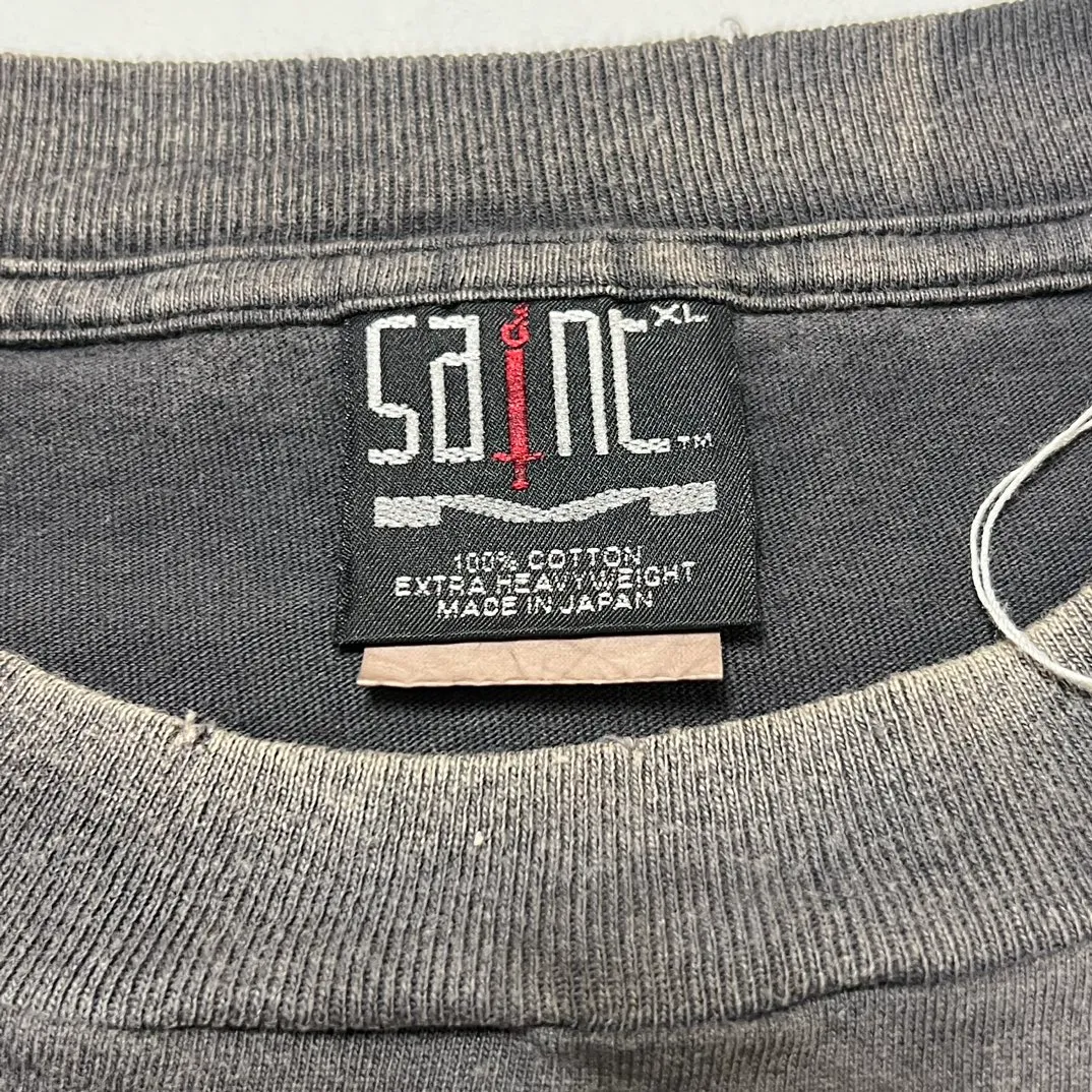 SAINT Mxxxxxx LS TEE/TEMPEST/BLK 'TEMPEST SAINT' Storm Religious Saints Cracked Retro Vulcanized Heavy Wash Long Sleeves Washed Black S-XL Assute Dyeing Multi-bit Horse Fading Craftsmanship Grinding and Hanging Holes Full of Old Feeling Top Printing Craftsmanship Purchasing Level